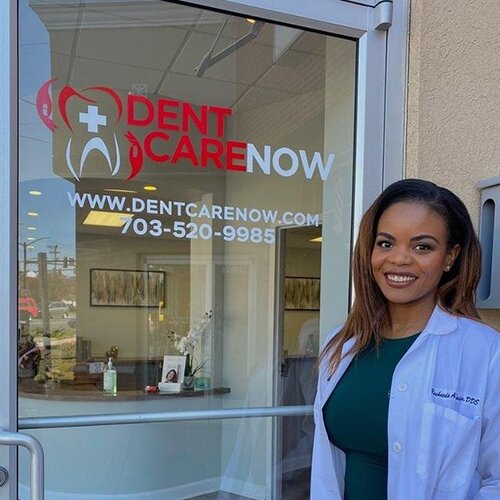 Team member smiling outside Dentcare Now emergency dental office in Centreville, VA